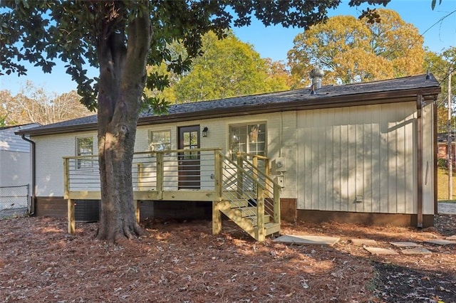 rear view of property with a deck