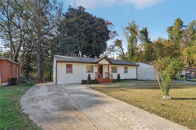 single story home featuring cooling unit and a front lawn