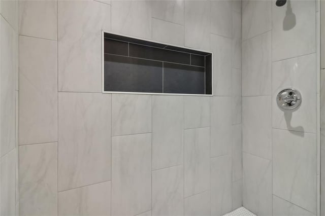 details with a tile shower