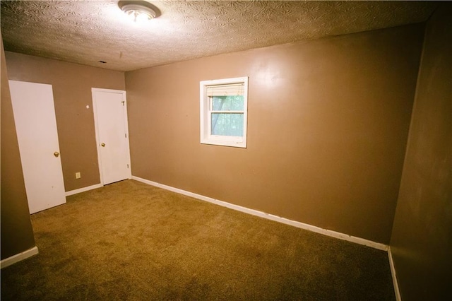 4190 Heather Way, Cumming, GA 30041 - unfurnished bedroom with carpet flooring, a textured ceiling, and baseboards