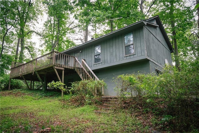 4190 Heather Way, Cumming, GA 30041 - rear view of house with a wooden deck and stairs