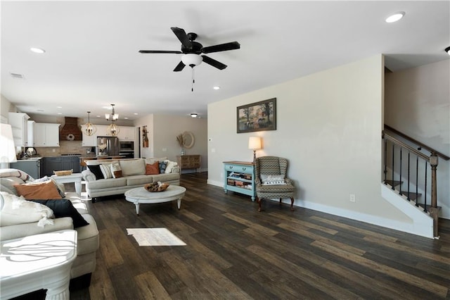 living room with ceiling fan and dark hardwood / wood-style flooring