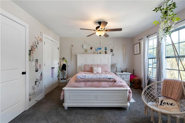 bedroom with ceiling fan and dark carpet