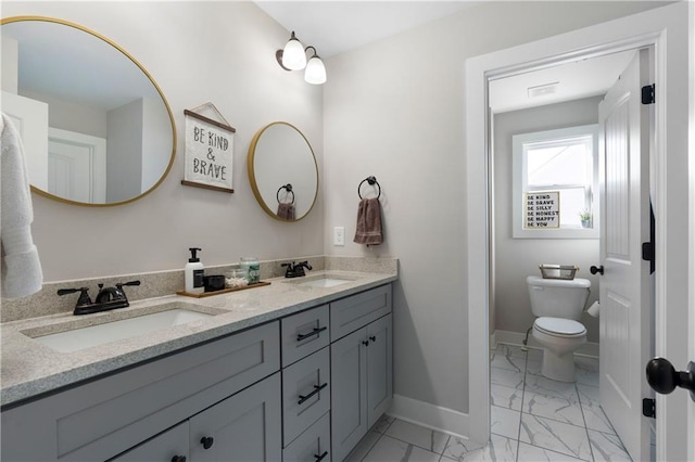 4 Doe Ct SE, Cartersville, GA 30120 - full bath with marble finish floors, double vanity, baseboards, and toilet