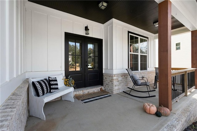 4 Doe Ct SE, Cartersville, GA 30120 - view of exterior entry featuring a porch, french doors, and board and batten siding