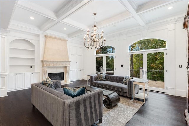 living room featuring coffered ceiling, dark wood-type flooring, a fireplace, and french doors