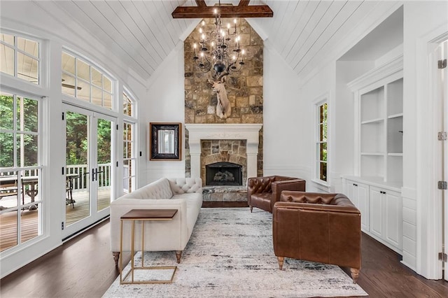 living room with high vaulted ceiling, a wealth of natural light, a fireplace, and dark hardwood / wood-style floors