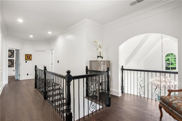 hallway with ornamental molding and dark wood-type flooring