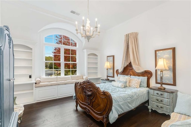 bedroom with dark wood-type flooring, crown molding, and a chandelier