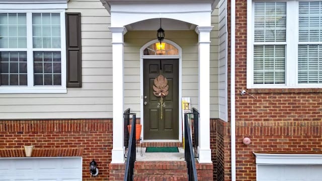 property entrance featuring a garage