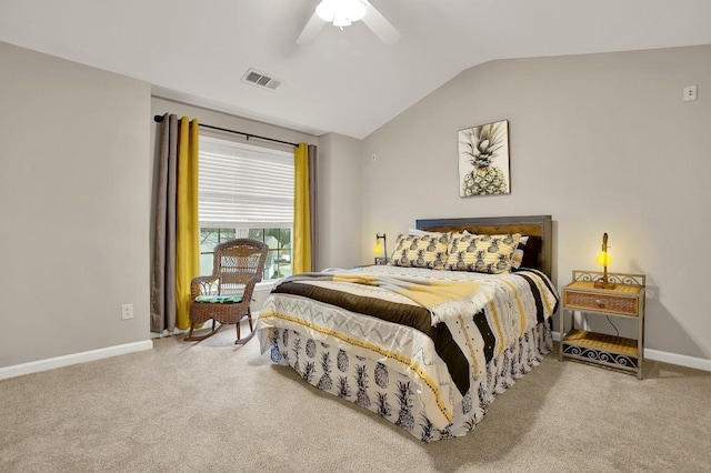 bedroom with ceiling fan, vaulted ceiling, and carpet