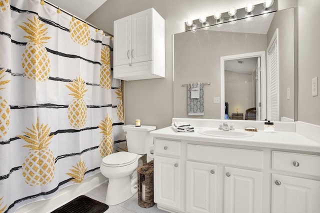 bathroom with tile patterned floors, toilet, a shower with shower curtain, and vanity