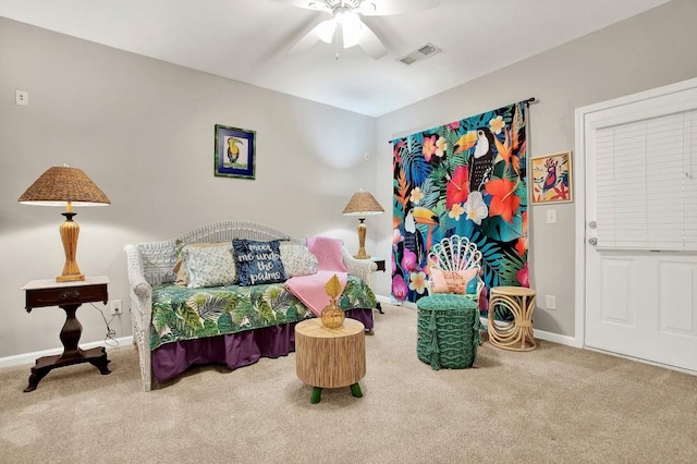 interior space with carpet flooring and ceiling fan