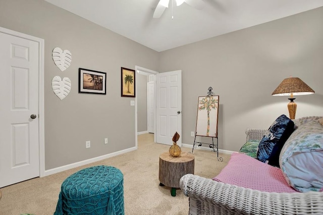 sitting room with carpet floors and ceiling fan