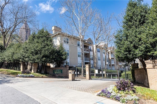 view of property with fence