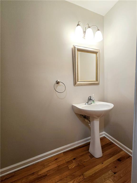 bathroom with wood-type flooring