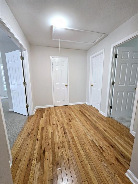 unfurnished room with light hardwood / wood-style floors