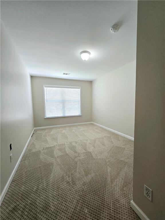 empty room with light carpet