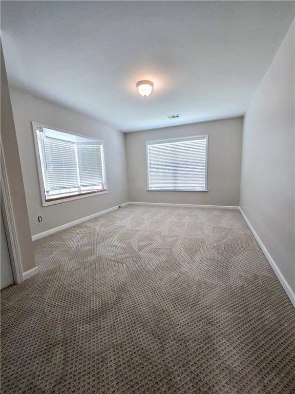 unfurnished room with carpet floors