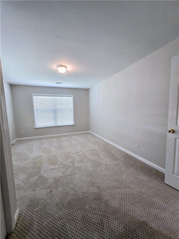 spare room with carpet flooring