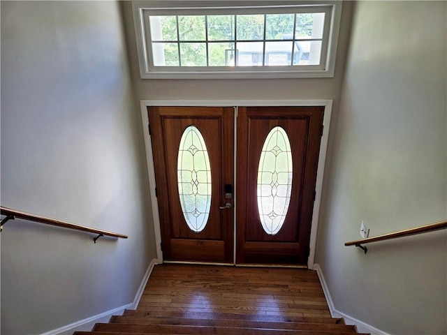 foyer with dark hardwood / wood-style flooring