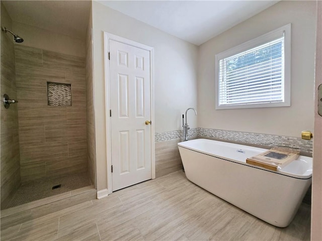 bathroom featuring tile patterned floors and shower with separate bathtub