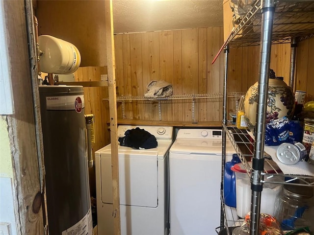 10199 Starr St SW, Covington, GA 30014 - laundry room with water heater, wood walls, and washer and dryer