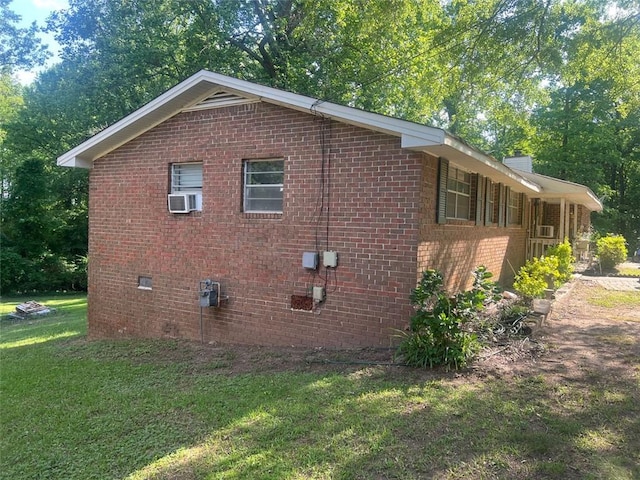 10199 Starr St SW, Covington, GA 30014 - view of side of property with a yard, brick siding, and crawl space