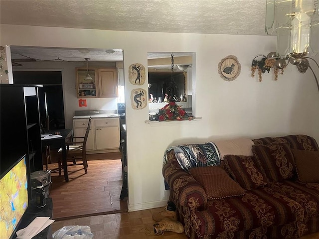 10199 Starr St SW, Covington, GA 30014 - living area featuring a textured ceiling and parquet floors