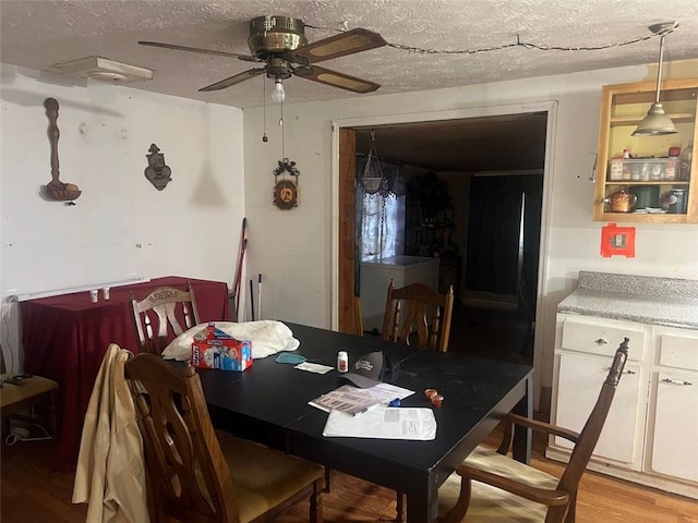 10199 Starr St SW, Covington, GA 30014 - dining space featuring a ceiling fan, a textured ceiling, and light wood-type flooring