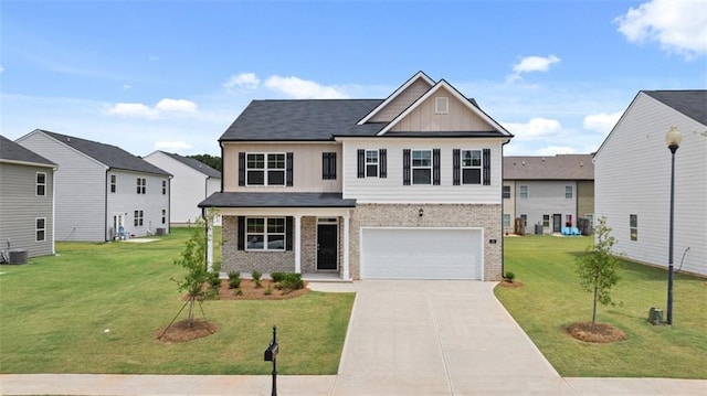 25 Amberjack Trl, Covington, GA 30016 - craftsman house with board and batten siding, brick siding, an attached garage, driveway, and a front lawn