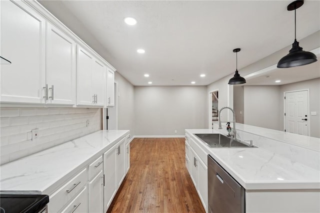 kitchen featuring white cabinets, sink, pendant lighting, hardwood / wood-style flooring, and dishwasher