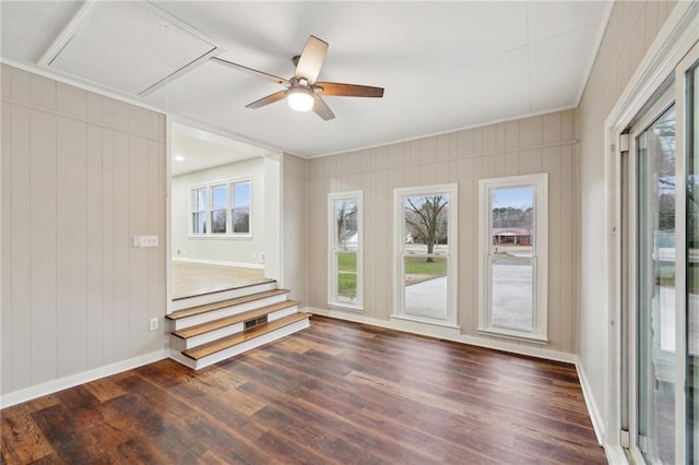 spare room with dark hardwood / wood-style floors, plenty of natural light, and ceiling fan