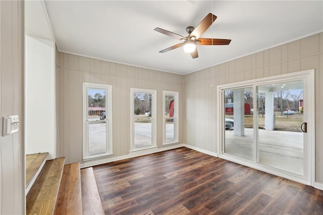 spare room featuring ceiling fan and dark wood-type flooring