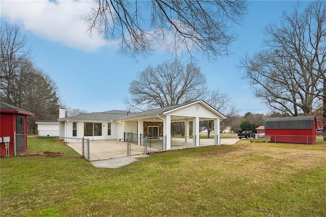 back of house with a yard