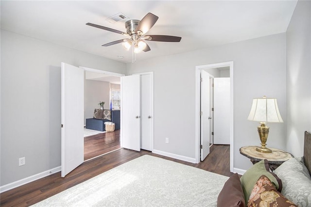 bedroom featuring dark wood-type flooring and ceiling fan