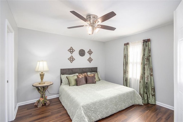 bedroom featuring dark wood-type flooring and ceiling fan