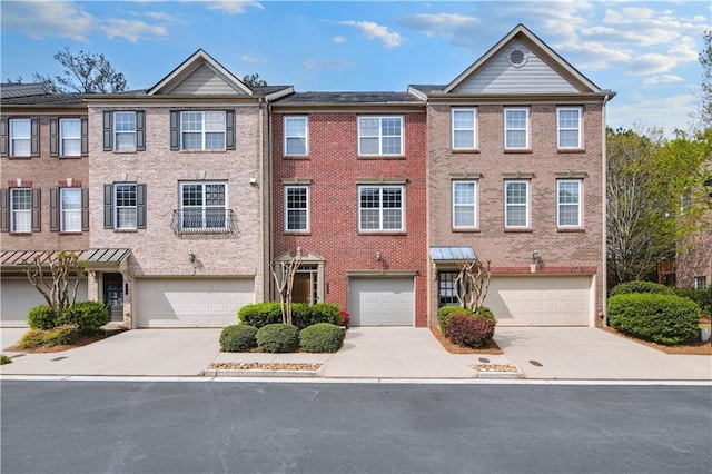 5748 Pine Oak Dr NW, Norcross, GA 30092 - multi unit property featuring driveway, a garage, and brick siding