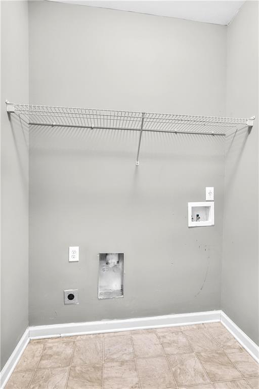 5748 Pine Oak Dr NW, Norcross, GA 30092 - laundry room with electric dryer hookup, washer hookup, laundry area, and baseboards