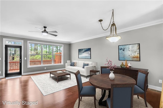 5748 Pine Oak Dr NW, Norcross, GA 30092 - dining space featuring baseboards, wood finished floors, and crown molding