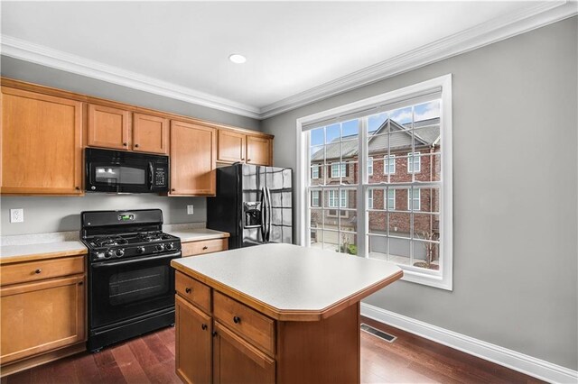 5748 Pine Oak Dr NW, Norcross, GA 30092 - kitchen featuring black appliances, ornamental molding, dark wood-style flooring, and light countertops