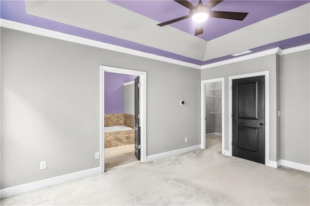 5748 Pine Oak Dr NW, Norcross, GA 30092 - unfurnished bedroom featuring a walk in closet, connected bathroom, baseboards, and carpet floors