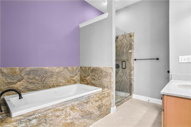 5748 Pine Oak Dr NW, Norcross, GA 30092 - bathroom featuring a stall shower, baseboards, tile patterned floors, a garden tub, and vanity