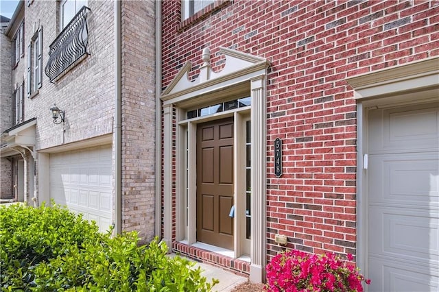 5748 Pine Oak Dr NW, Norcross, GA 30092 - doorway to property featuring a garage and brick siding