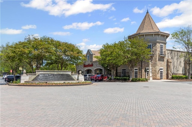 5748 Pine Oak Dr NW, Norcross, GA 30092 - view of building exterior featuring uncovered parking