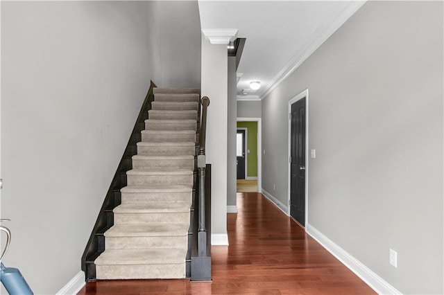 5748 Pine Oak Dr NW, Norcross, GA 30092 - stairs featuring baseboards, wood finished floors, and crown molding