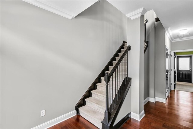 5748 Pine Oak Dr NW, Norcross, GA 30092 - staircase with baseboards, wood finished floors, and crown molding