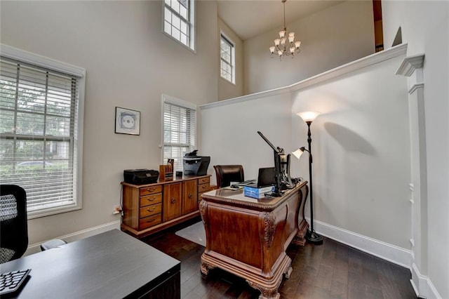 4191 Secret Shoals Way, Buford, GA 30518 - home office with a chandelier, healthy amount of natural light, a towering ceiling, and dark wood-style floors