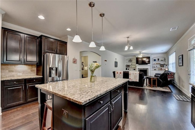 4191 Secret Shoals Way, Buford, GA 30518 - kitchen featuring ornamental molding, stainless steel fridge with ice dispenser, arched walkways, a fireplace, and ceiling fan