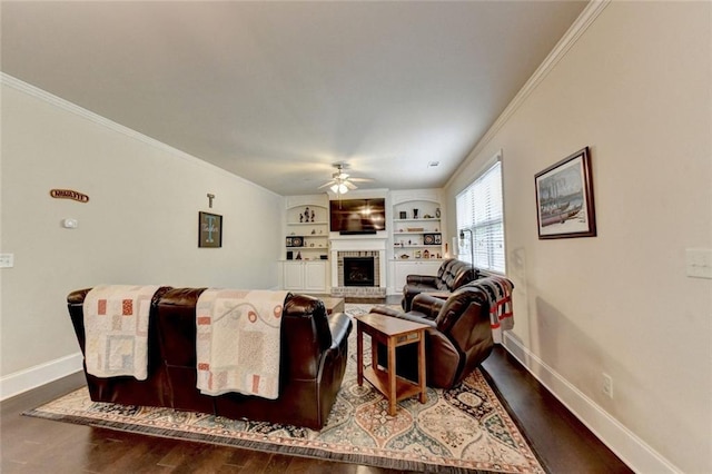 4191 Secret Shoals Way, Buford, GA 30518 - living room with ceiling fan, dark wood-style flooring, baseboards, a fireplace, and ornamental molding